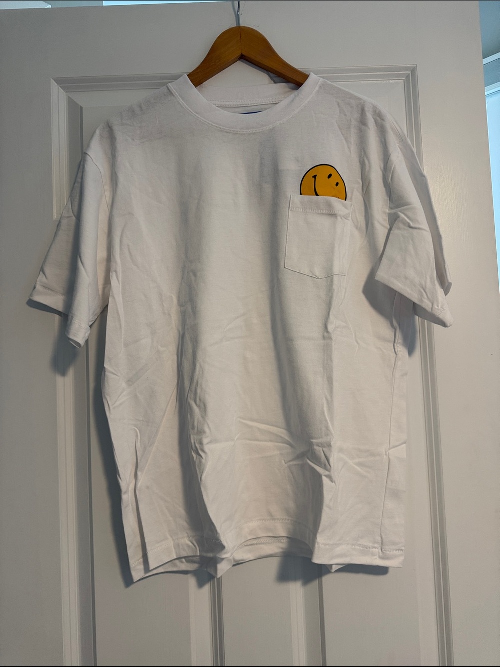 White Men's Pocket T-Shirt with Yellow Smiley Graphic